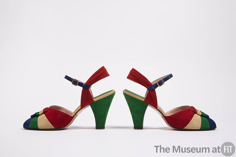 Pair of green, red, blue and white sling back open toe sandals with color blocked vamp, blue an…