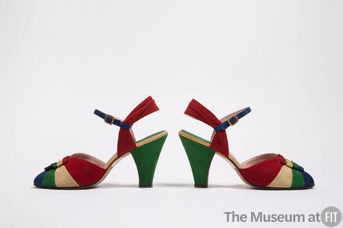 Pair of green, red, blue and white sling back open toe sandals with color blocked vamp, blue an…