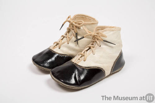Off-white leather childerens lace-up boots with black toe and heel caps