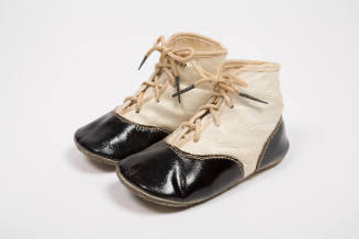 Off-white leather childerens lace-up boots with black toe and heel caps