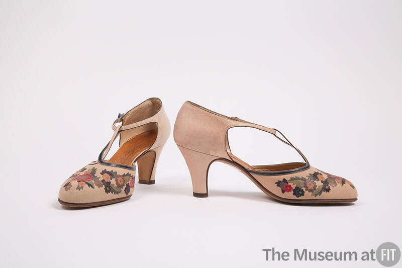 Pair of beige D'Orsay T-strap shoes with blue, green, pink, purple and red floral appliqué on v…
