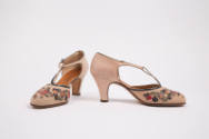Pair of beige D'Orsay T-strap shoes with blue, green, pink, purple and red floral appliqué on v…