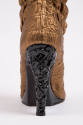 Bronze metallic boots with overall puckered quilt stitch; black wedge platform at back sole, an…