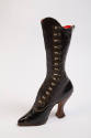 Tall black leather boot with side buttons on scalloped edge with high heel and extreme curved i…