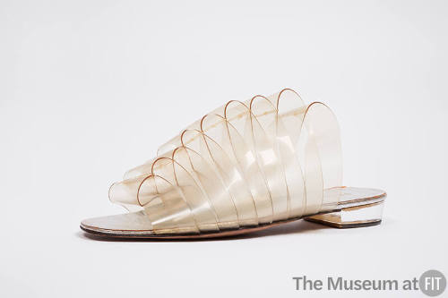 Low heeled mule sandal made of looped clear vinyl strips