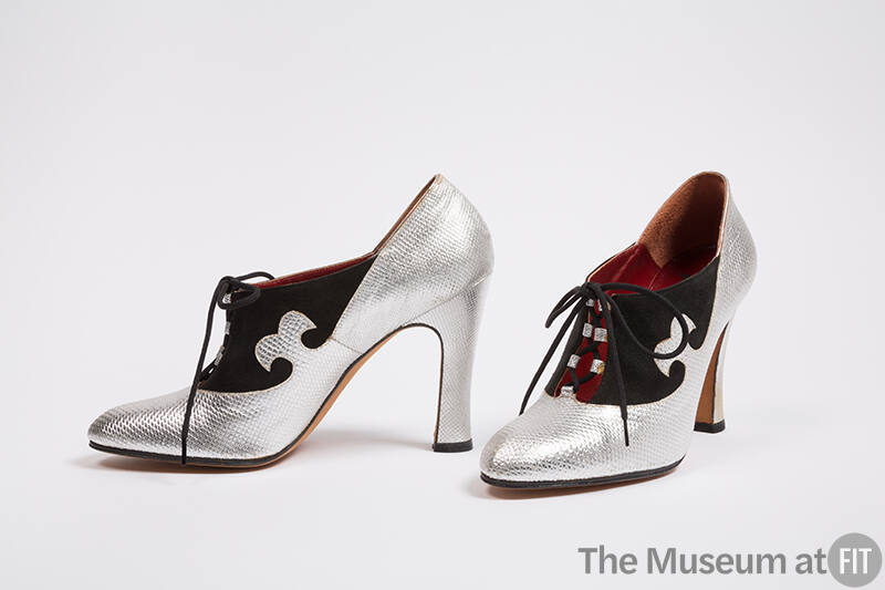 Silver snakeskin high heel with black suede detailing and laces