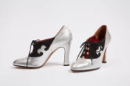 Silver snakeskin high heel with black suede detailing and laces