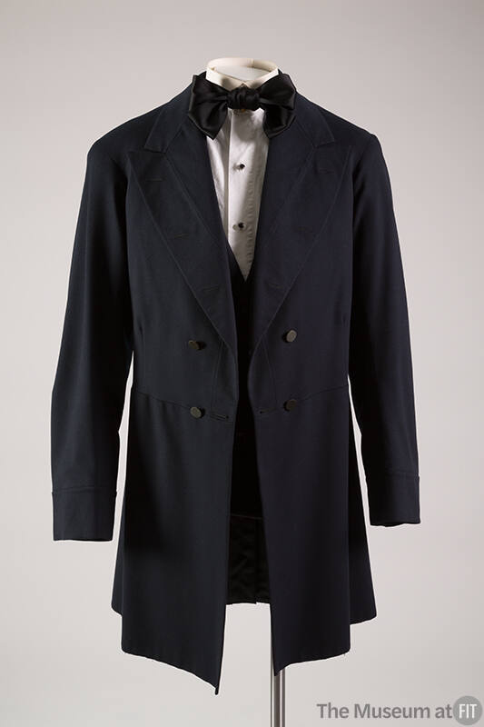 navy men's coat with black bow tie and white button down shirt