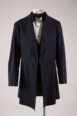 navy men's coat with black bow tie and white button down shirt
