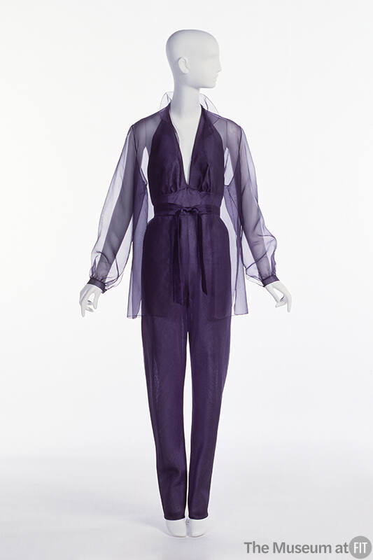 Purple organza jumpsuit with halter neck; matching sheer overblouse.