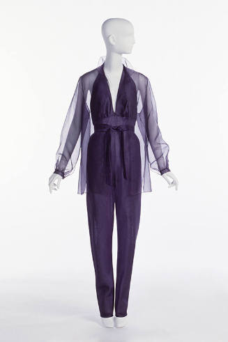 Purple organza jumpsuit with halter neck; matching sheer overblouse.