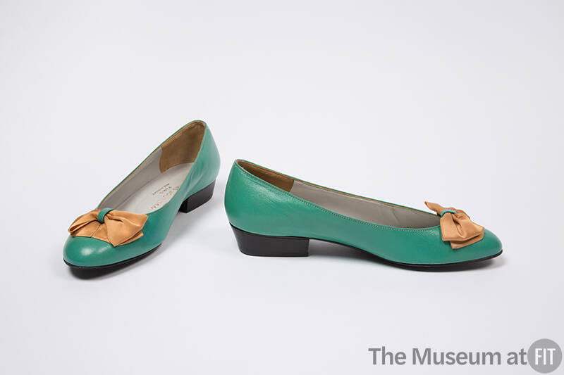 Green leather pumps with orange satin ribbon bow and low heel
