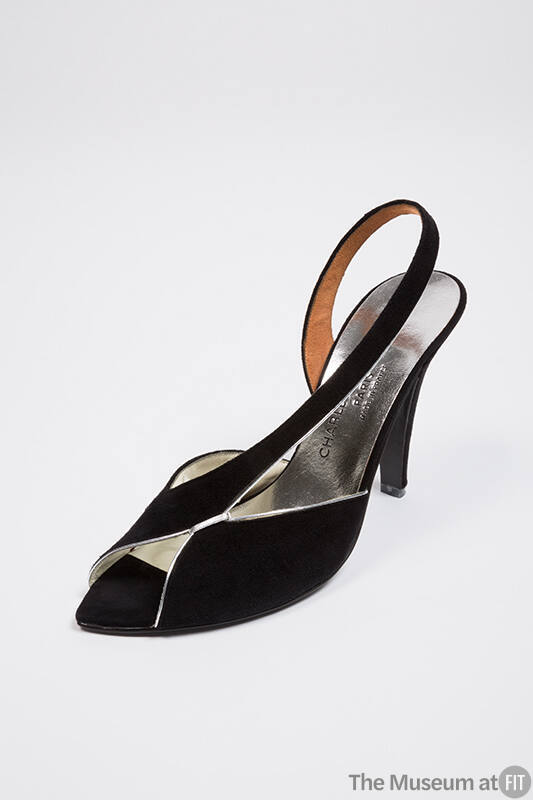 Black open toe slingback pump with silver metallic piping and asymmetric vamp strap