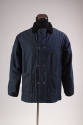 Blue denim snap front jacket with black collar and patch pockets  