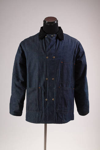 Blue denim snap front jacket with black collar and patch pockets  