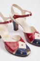 Detail of red, white and blue ankle strap high heel shoes with gold stars 