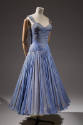light purple evening sleeveless dress with shoulder straps and pleated full skirt