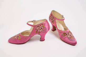 Pair of pink ankle strap pumps embroidered with pink, white, green and blue flower motif and Lo…