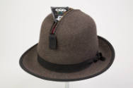 Alternate view of man’s brown charcoal wool hat on a pole with a NYC condom in zippered compart…