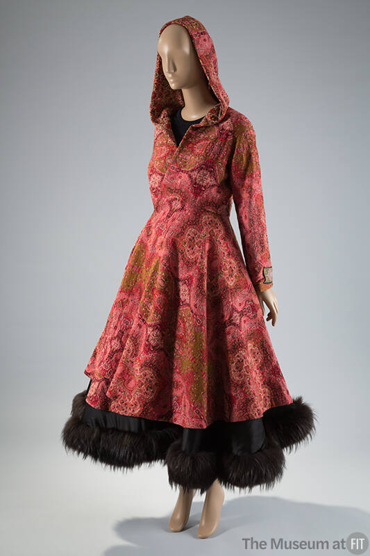 Red hooded jacquard paisley print coat, long sleeves over fur hem to-the-ankle skirt