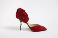 Alternate view of red suede high heel shoe with green metal stem heel and petal back, open side…