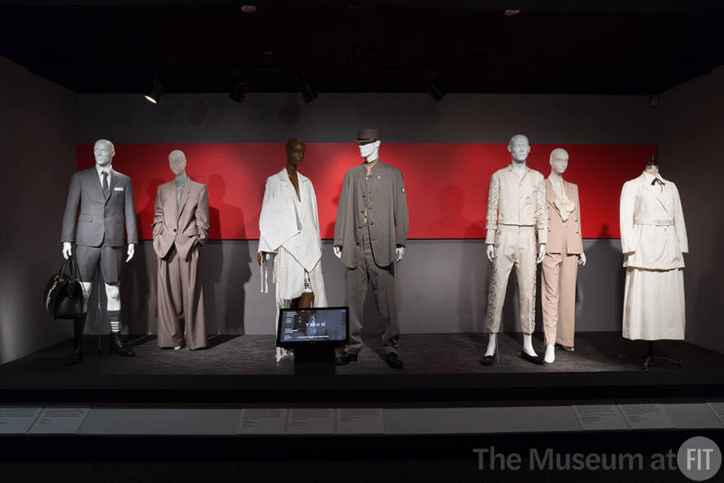 Power_Mode_09 Left to Right (see _07 for first two ensembles), 2019.18.1 (ensemble), 93.26.1 (uniform), 2016.86.1 (suit), 86.101.17 (suit), P87.25.1 (skirt suit)