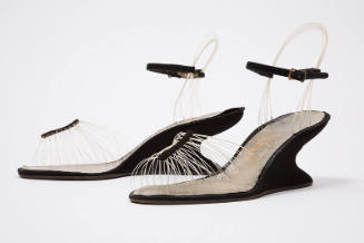 black heels and ankle straps with transparent fishing line strands for illusion of invisible sa…