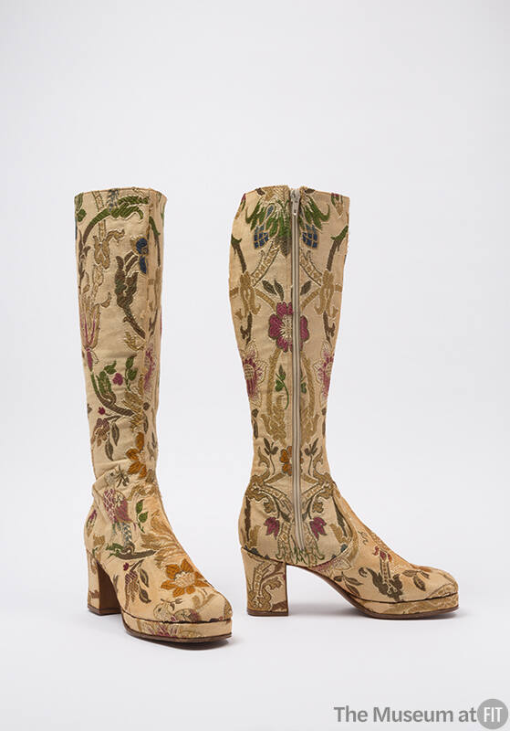 Knee high beige boots with floral and bird motifs in olive, green, gold, and red
