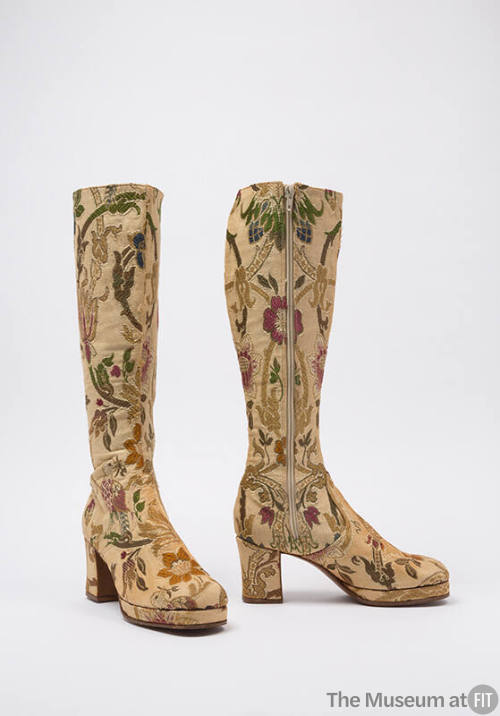 Knee high beige boots with floral and bird motifs in olive, green, gold, and red