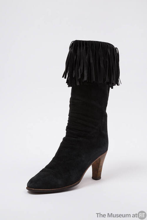 Black suede ruched ankle boot with fringe trim and wood high heels