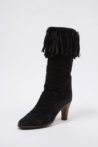 Black suede ruched ankle boot with fringe trim and wood high heels