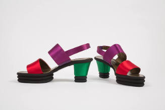 Pair of sling back sandals with wide red toe strap, purple instep strap, green block heel and b…