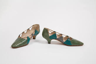 Pair of green low heeled lizard pumps with triangular pieces on sides in turquoise blue and gre…