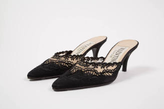 Pair of black high heel mules with scalloped vamp decorated with lace embroidery and beadwork a…
