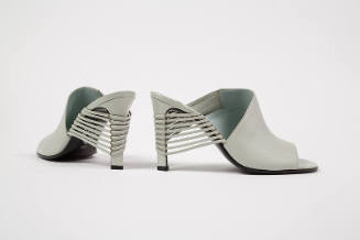 Pair of high heel pale grey mule sandals with open toe and vamp of narrow strips wrapping aroun…
