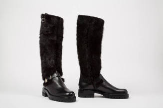 Black leather knee high boots with fur shaft and chunky soles