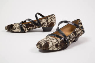 Brown and off-white animal print shoes with brown ankle straps and low heel
