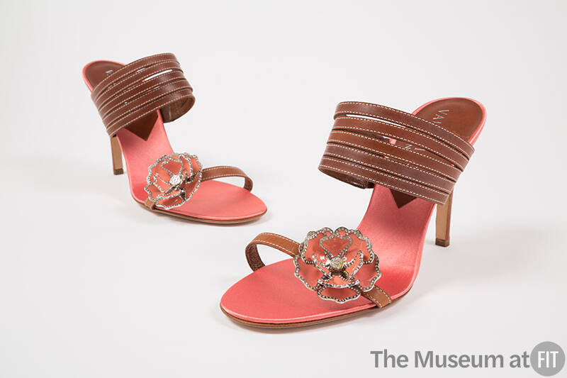 Pink satin high heel mules with tan leather straps and heel; pink metal flower with rhinestone …