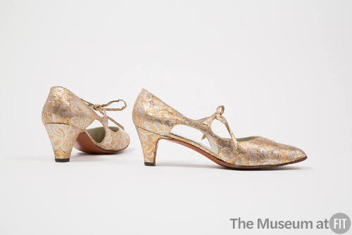 Pair of gold and silver metallic brocade evening pumps with arched cut outs either side, low he…