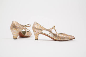 Pair of gold and silver metallic brocade evening pumps with arched cut outs either side, low he…