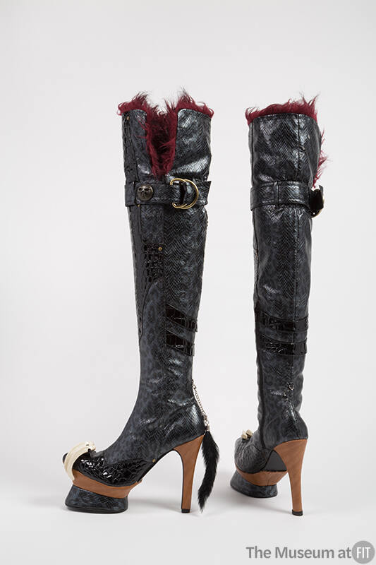 Black over-the-knee platform high heel boots with grey and black leopard printed patent leather…