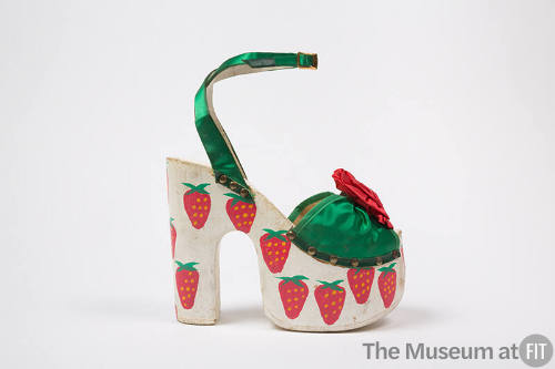 Green satin ankle strap open toe sandal with high white platform with painted strawberries 