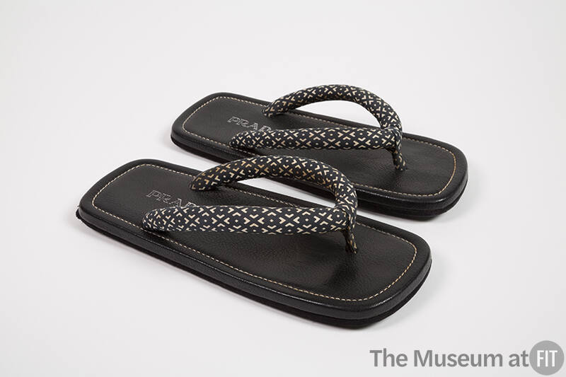 Black and white geometric pattern stuffed cotton thong sandals with black leather soles 