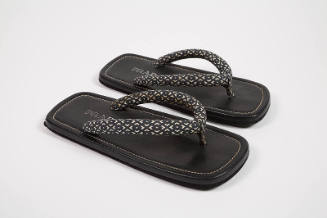 Black and white geometric pattern stuffed cotton thong sandals with black leather soles 