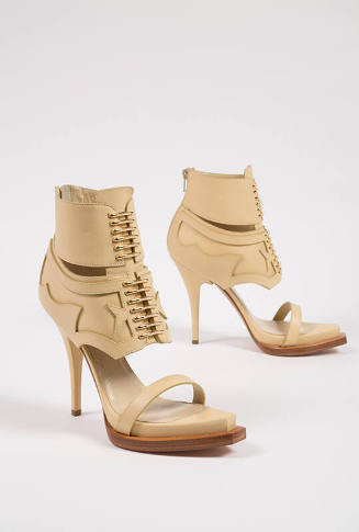 Tan high heel sandal, lace up ankle boots with cutaway pieces