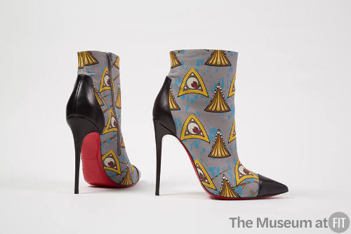 Pair of grey ankle boots with yellow, brown, green, burgundy and white triangular motif print, …