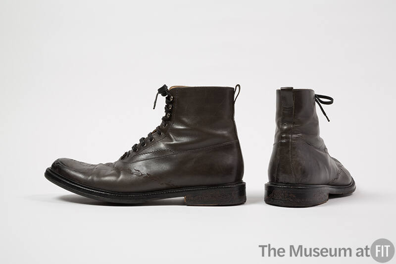 Pair of man’s dark grey/brown lace up ankle boots with tooled design across vamp