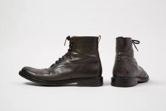 Pair of man’s dark grey/brown lace up ankle boots with tooled design across vamp
