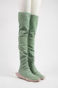 Pair of green scrunched above the knee boots with thick rubber soles