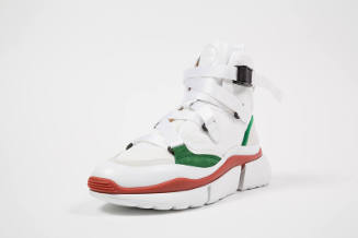 White high top sneaker with green and red accents, nylon strap laces and platform sole